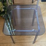 pair of smoked glass nesting tables