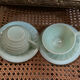 A pair of antique opaline tea cups.