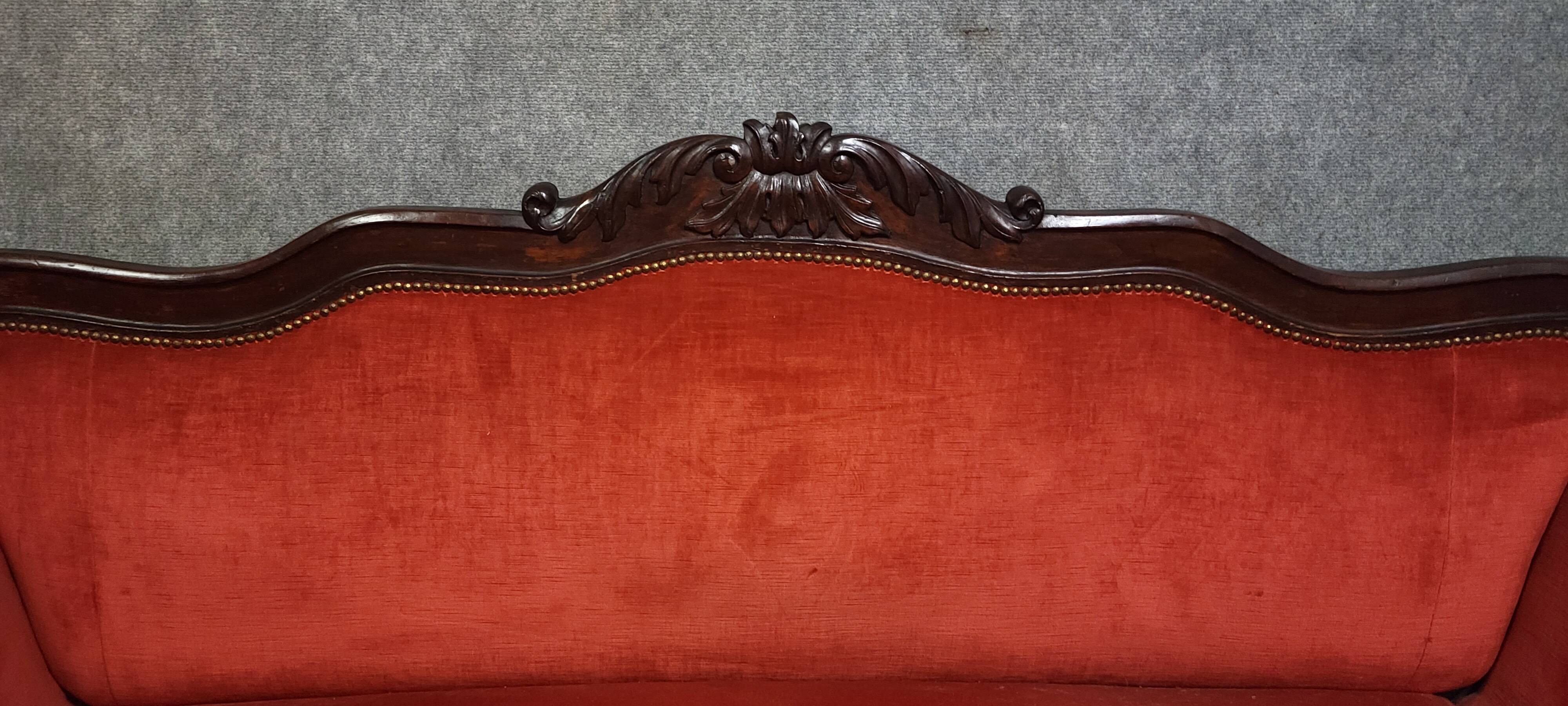 Sleeper or bench from the Charles X period in richly carved mahogany.