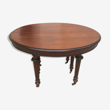 Oval table with extensions in massive mahogany napoleon III era.