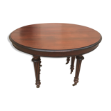 Oval table with extensions in massive mahogany napoleon III era.