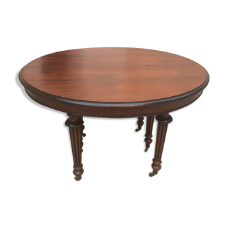 Oval table with extensions in massive mahogany napoleon III era.