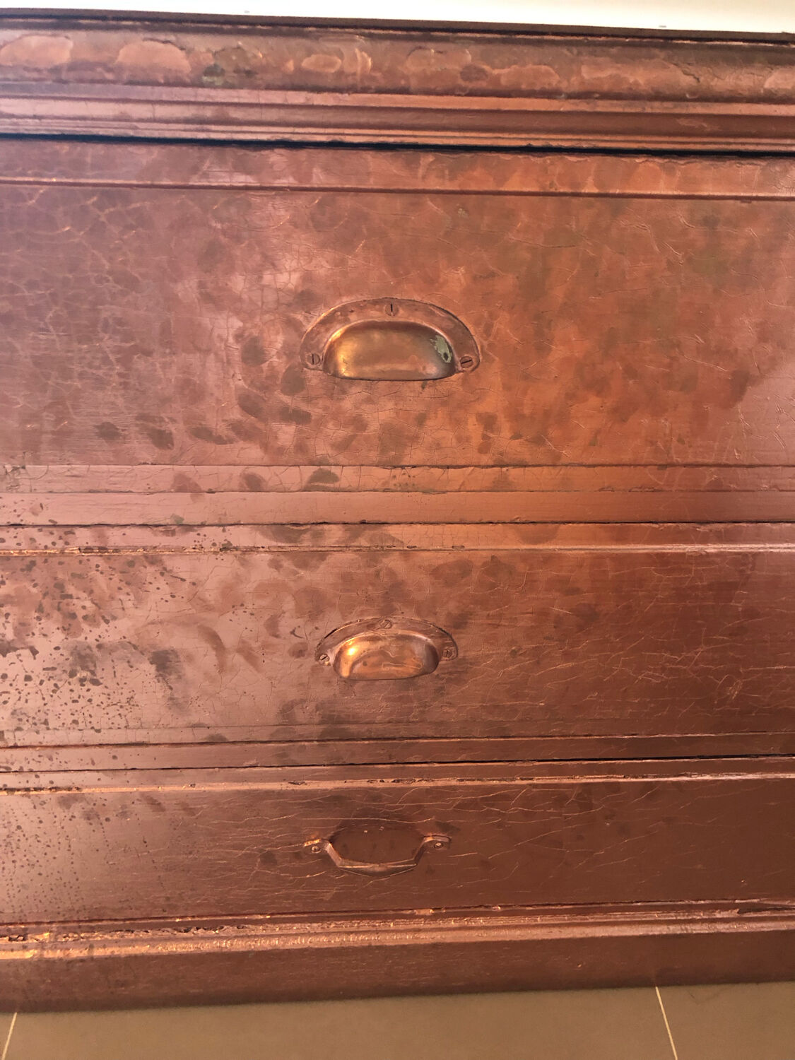 Old chest of drawers restored golden copper color