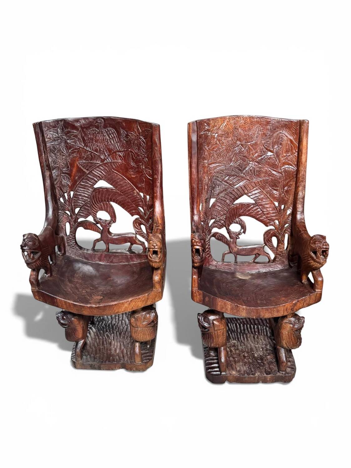 Pair of carved African armchairs