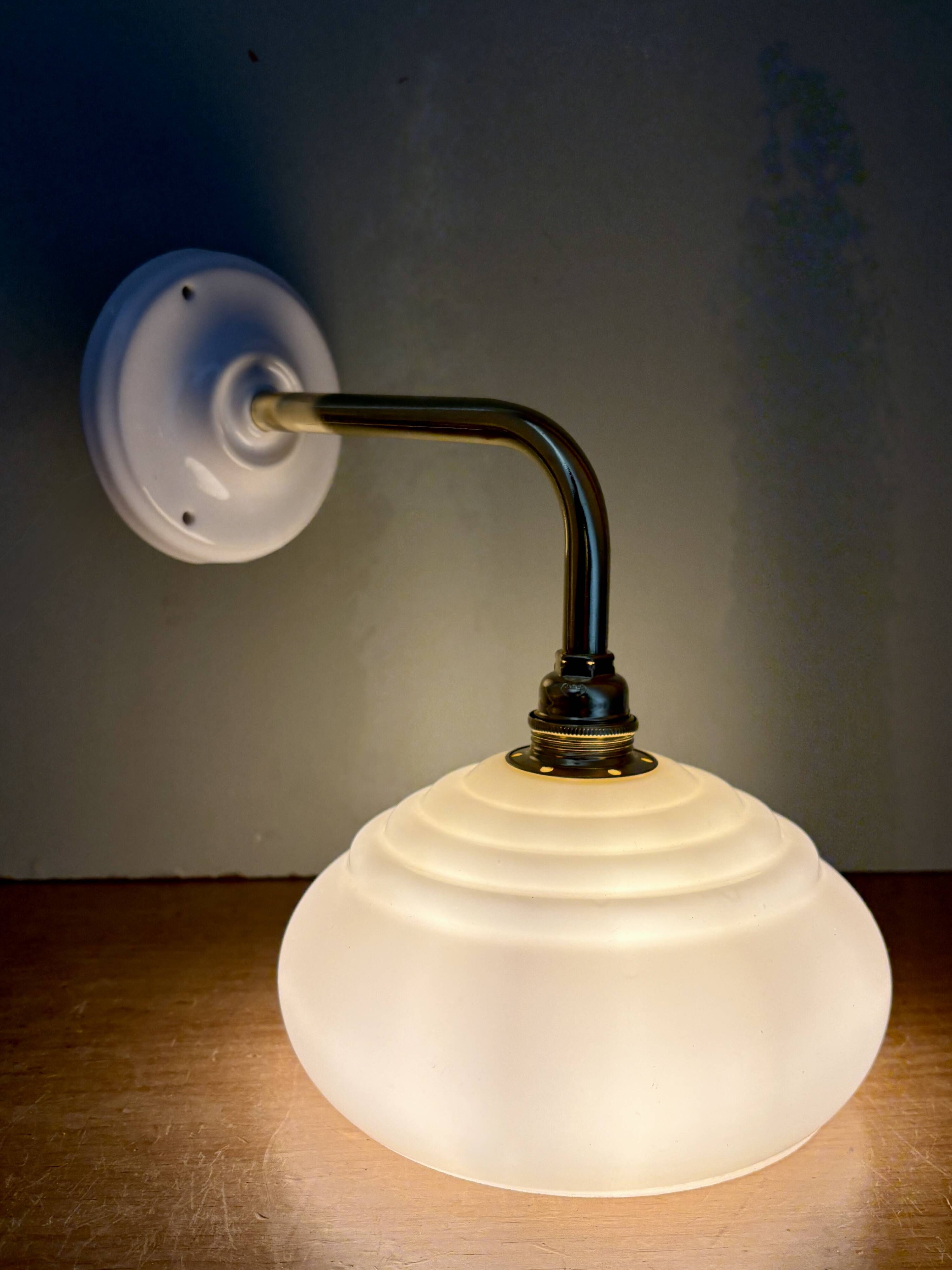 Vintage angled wall lamp with pale yellow opaline shade