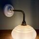 Vintage angled wall lamp with pale yellow opaline shade