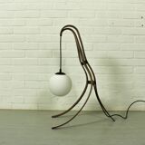 Sculptural table lamp with globe