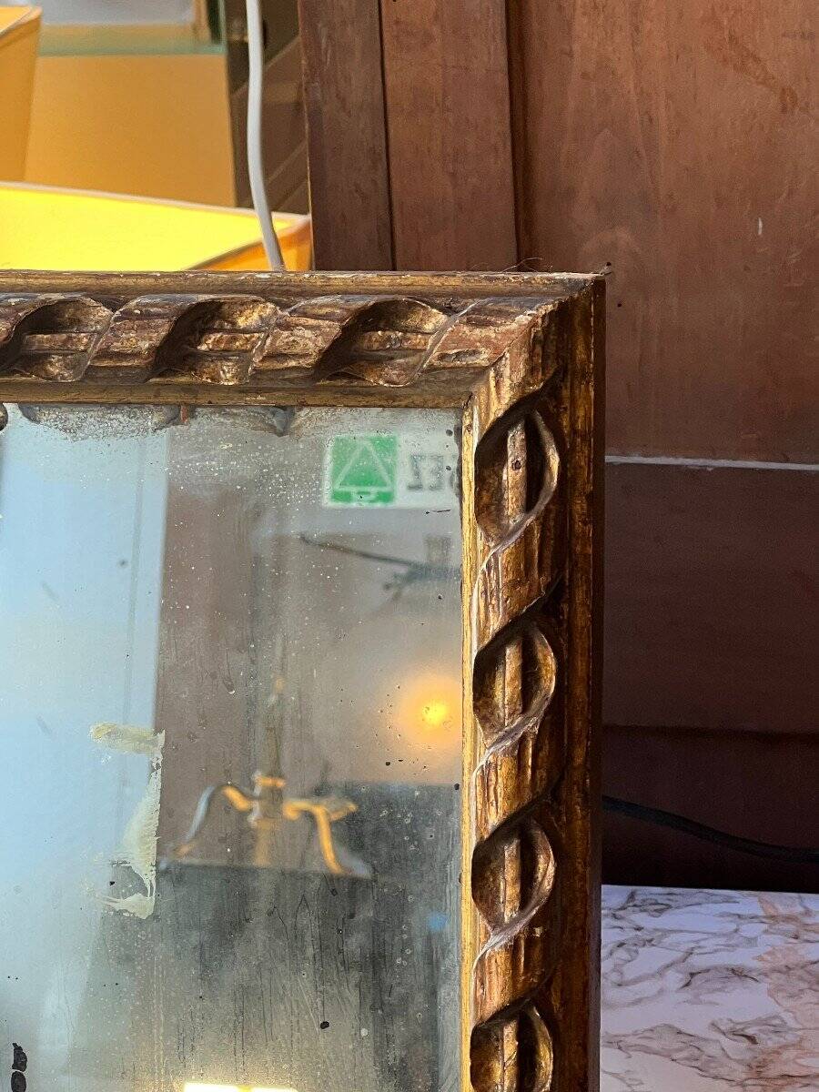 Antique mirror above a chest of drawers or between two windows, carved wood, 18th century