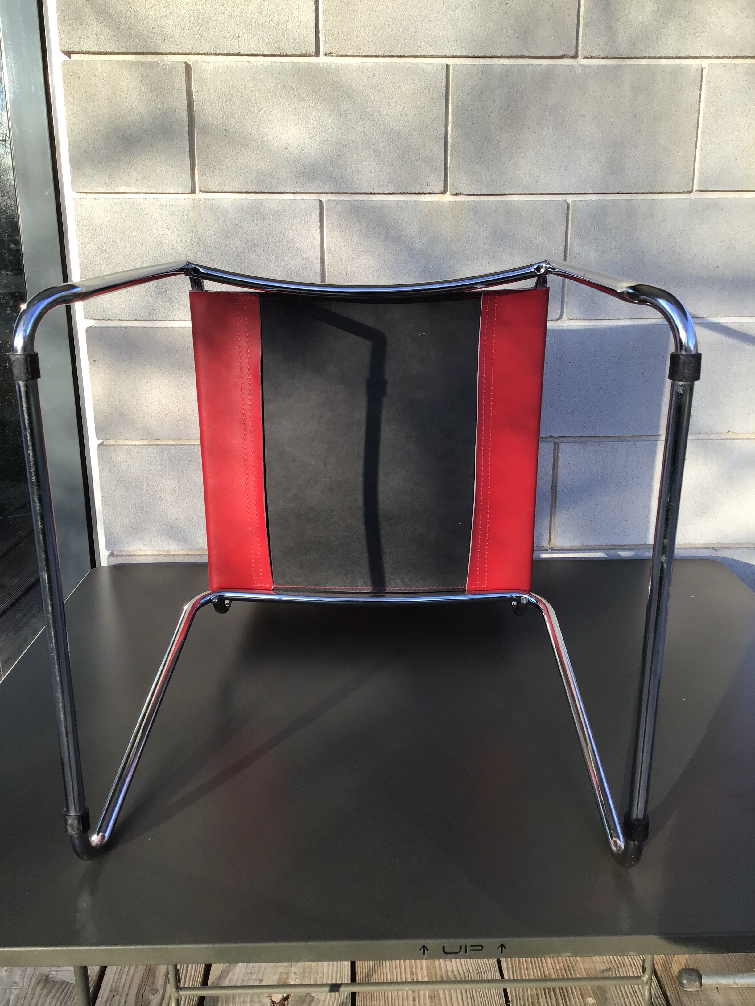 Chrome sled chair and red leather