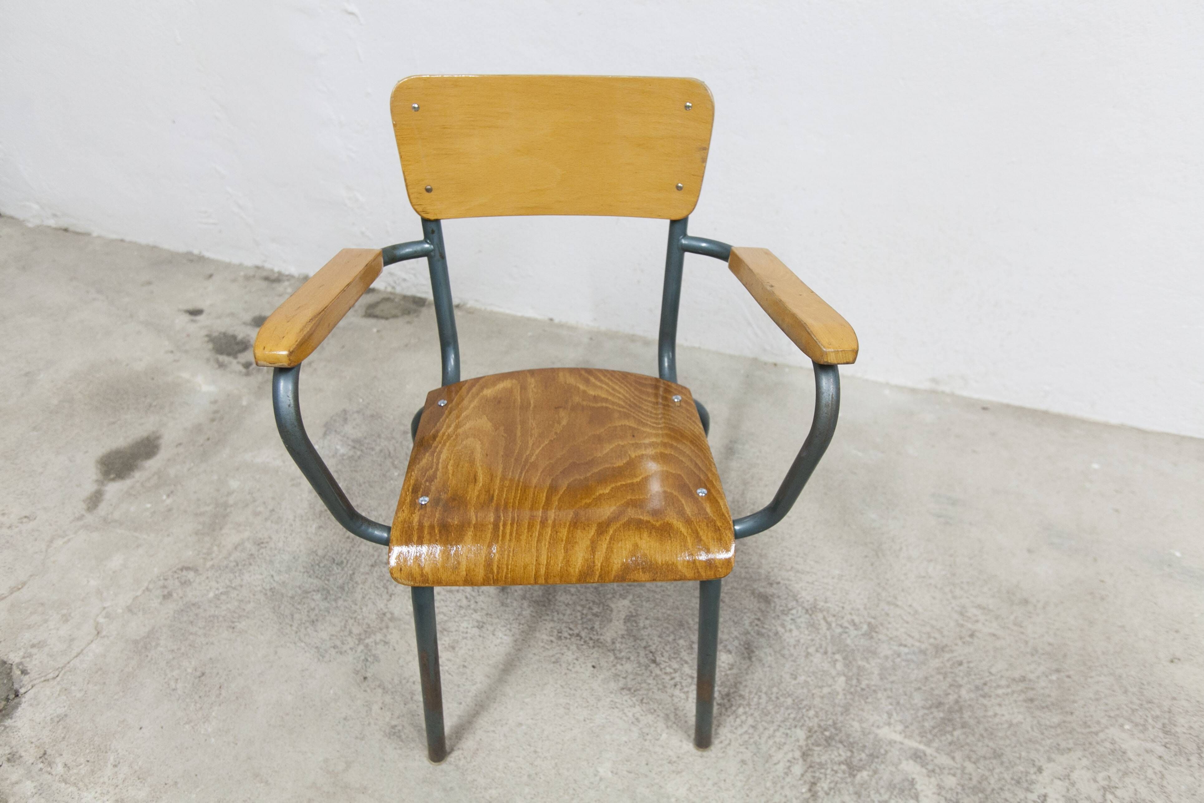 1962 school teacher's chair in honey color and tubular structure