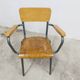 1962 school teacher's chair in honey color and tubular structure