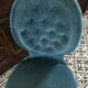Blue heater with fringed medallion shape
