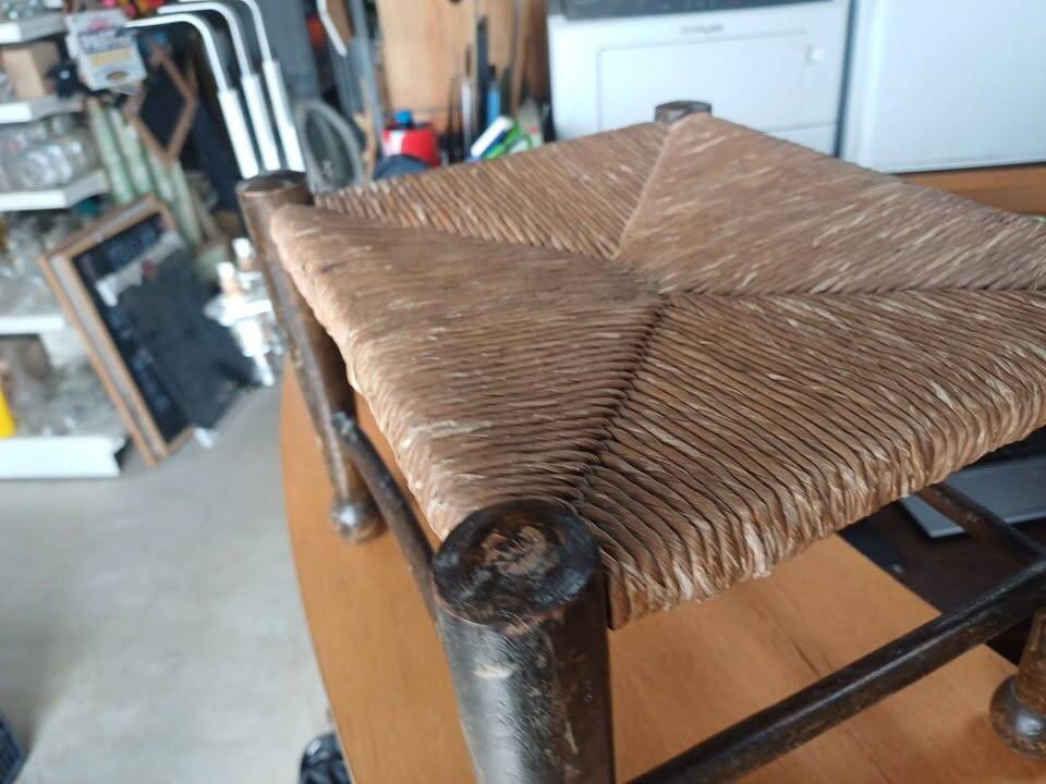 Small rustic vintage stool in wood and straw.