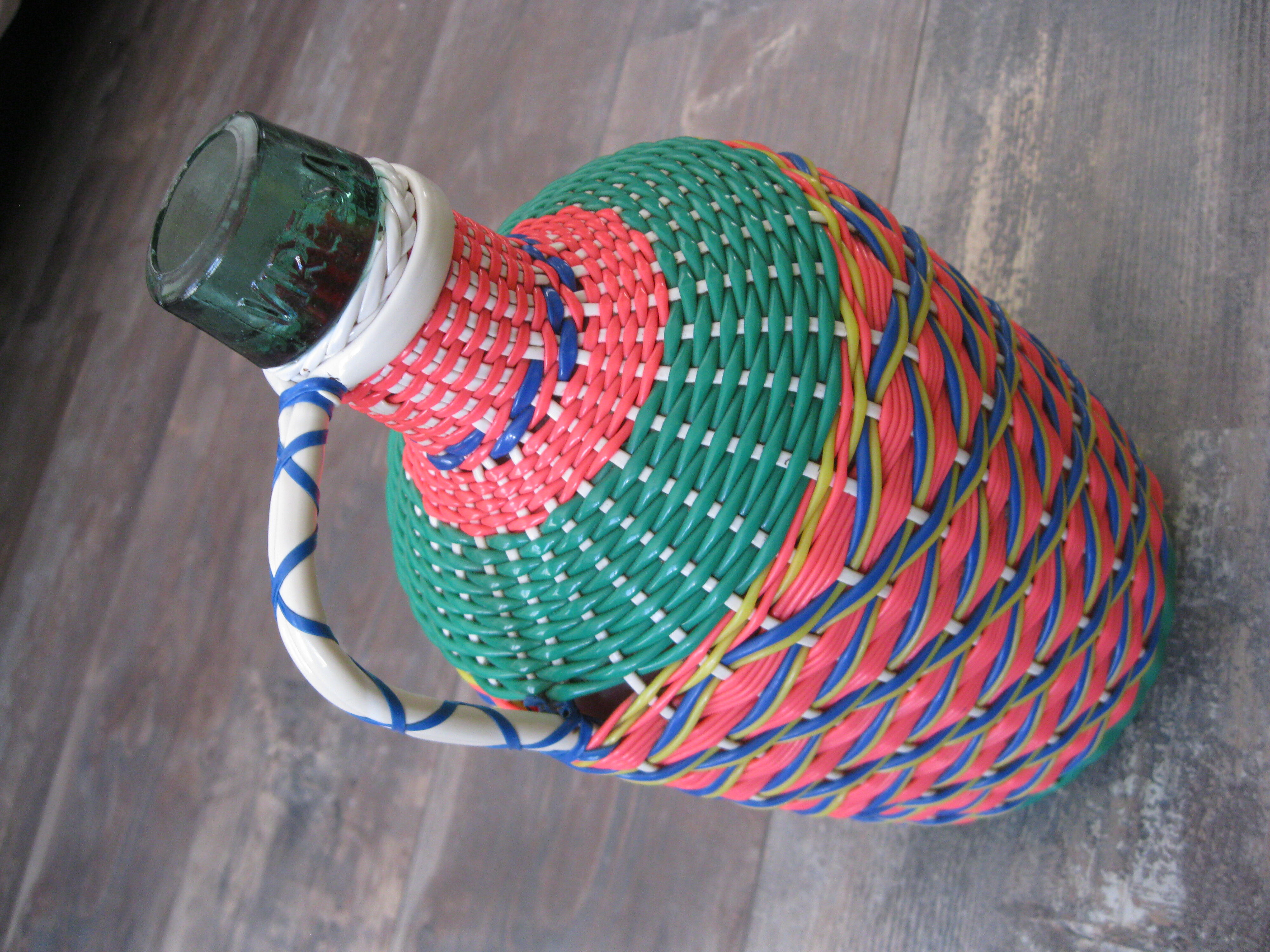 Vintage and multi-coloured demijohn