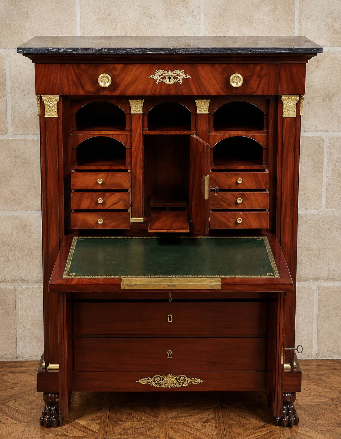 Rare four-column secretary from the Empire period in flame mahogany and bronze.