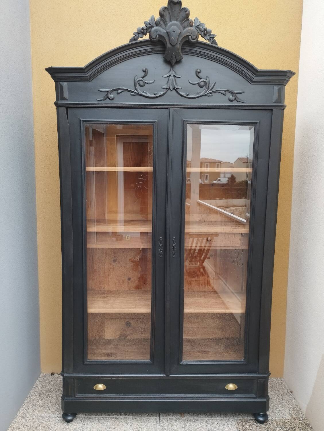 Bookcase black patina shell pediment 2 drawer doors