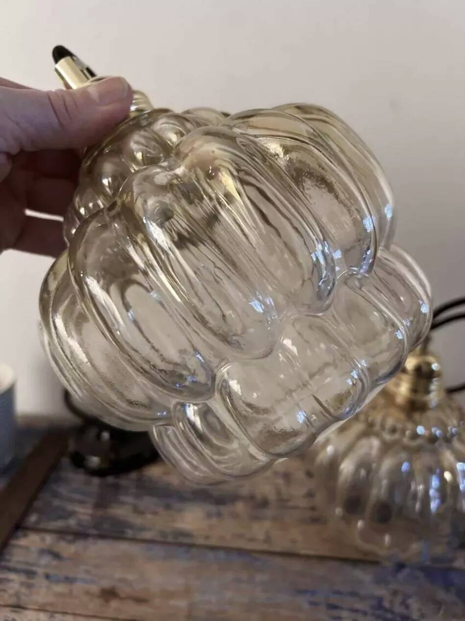 Pair of vintage amber glass pendant lights