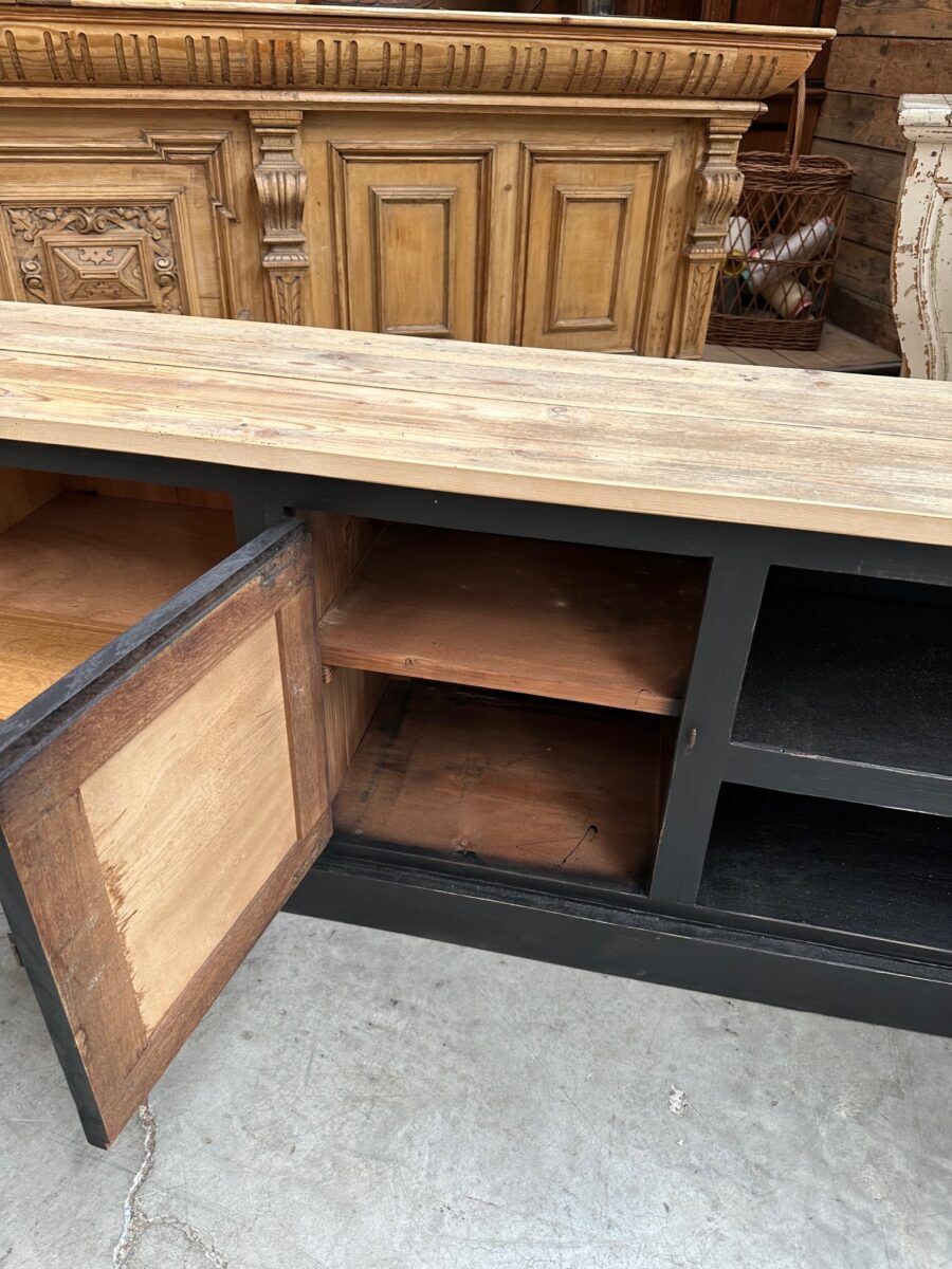 Old workshop furniture transformed into a TV unit.