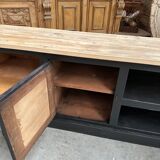 Old workshop furniture transformed into a TV unit.