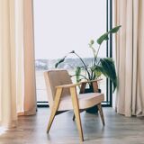 Vintage armchair in oak wood with powder pink boucle design by Chierowski.