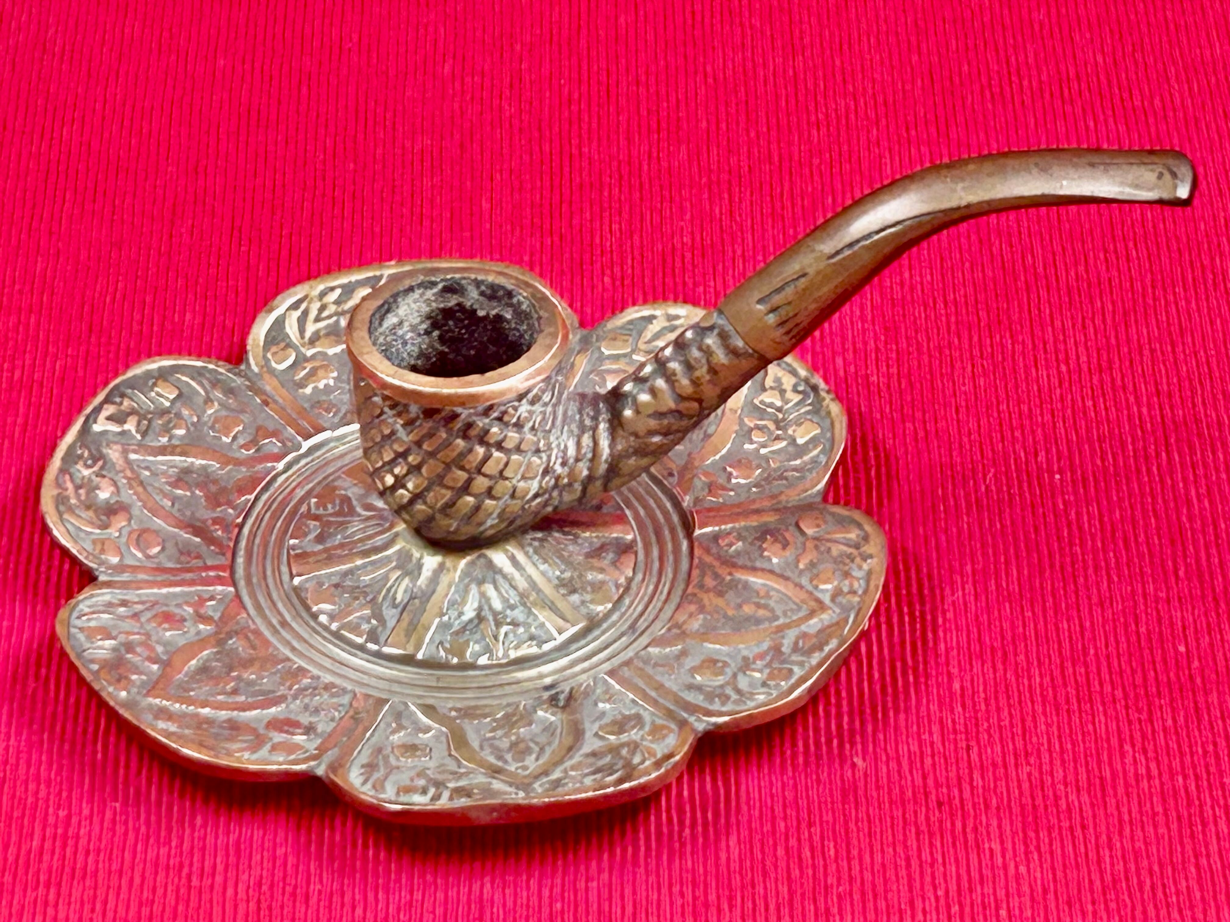 antique hand candlestick known as a rat of the cellar in bronze art Pipe