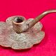 antique hand candlestick known as a rat of the cellar in bronze art Pipe