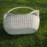 White wicker cradle basket