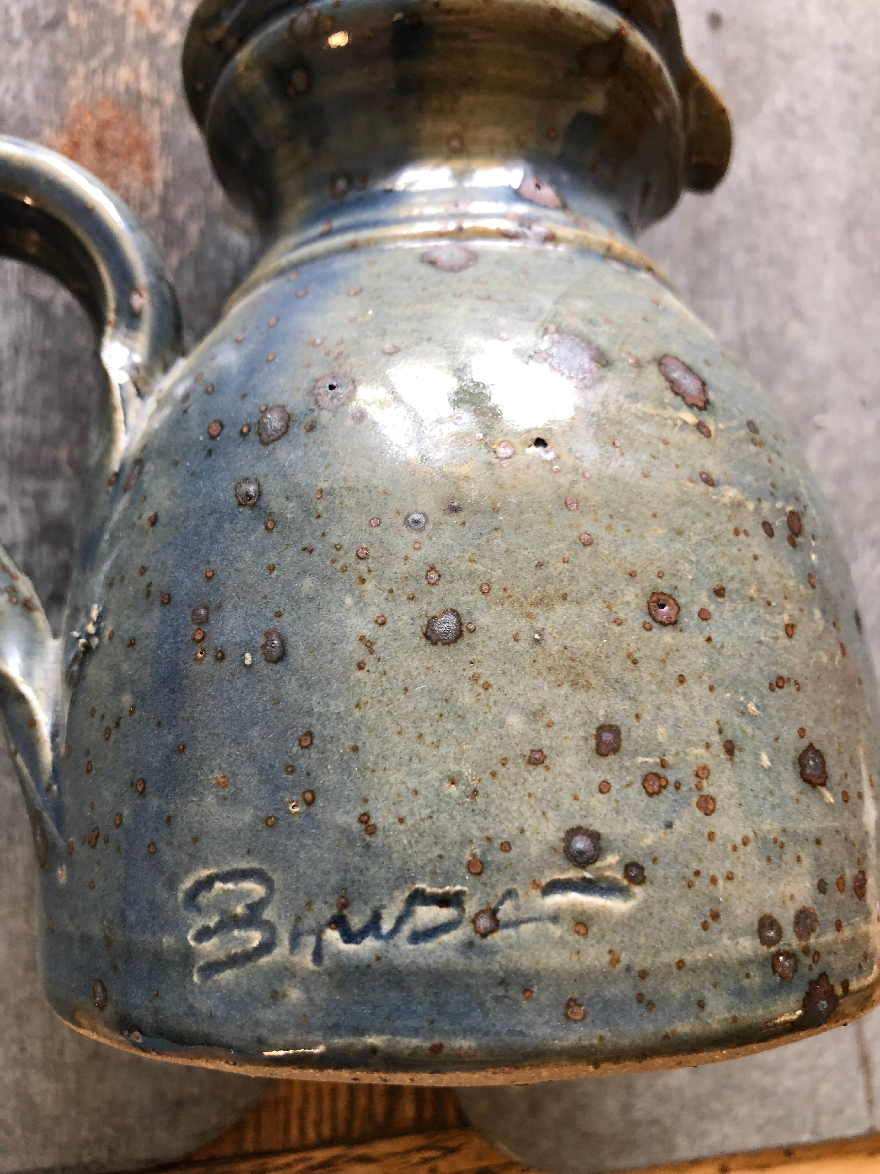 Handmade bluish enamelled sandstone pitcher speckled with brown