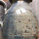 Handmade bluish enamelled sandstone pitcher speckled with brown