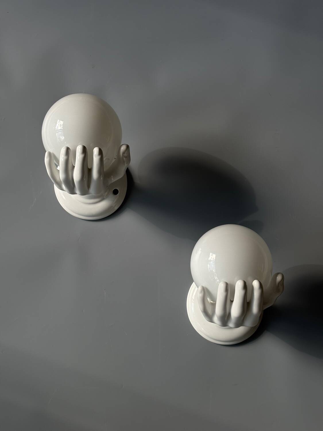Pair of opaline and ceramic hand sconces