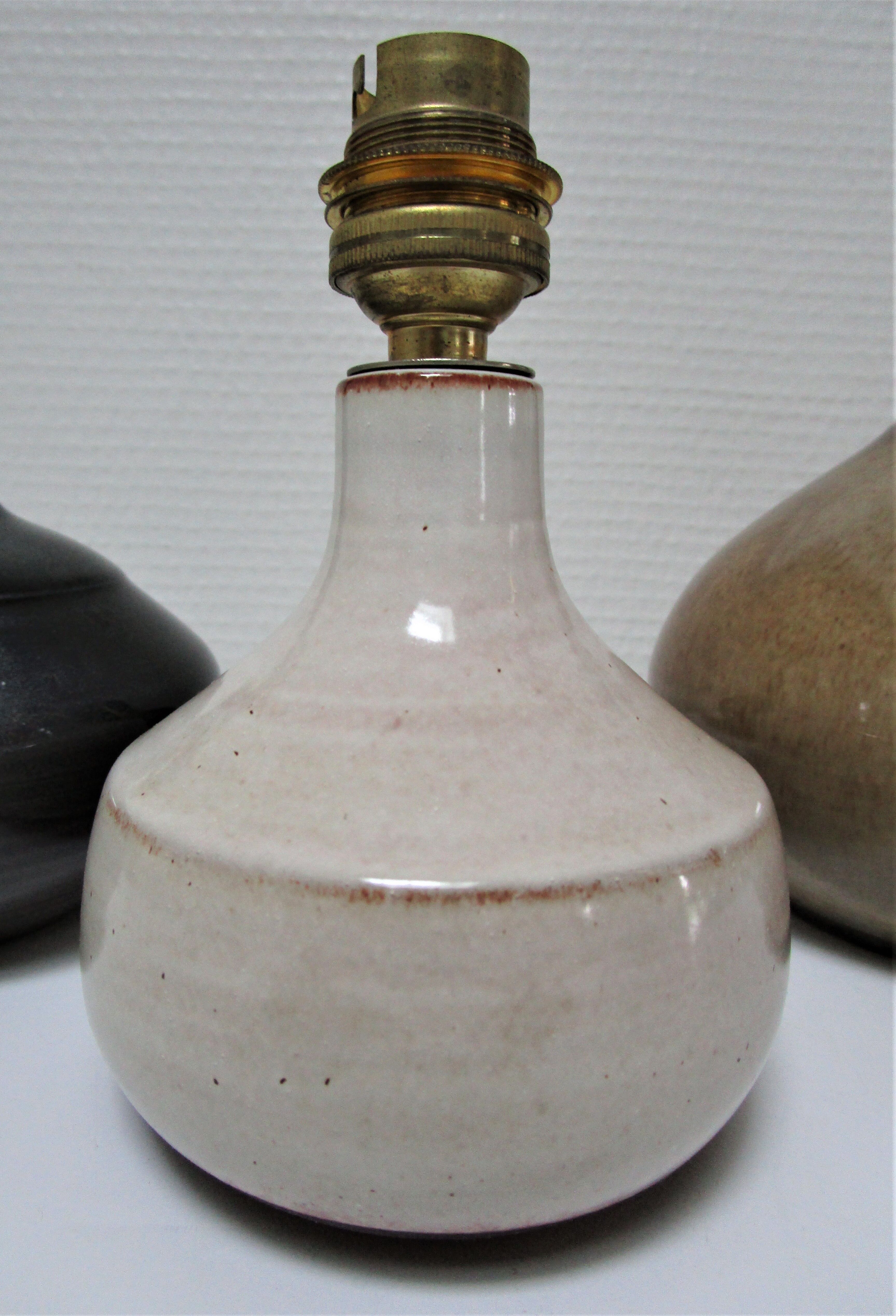 Three vintage ceramic lamps in blue, white and suede