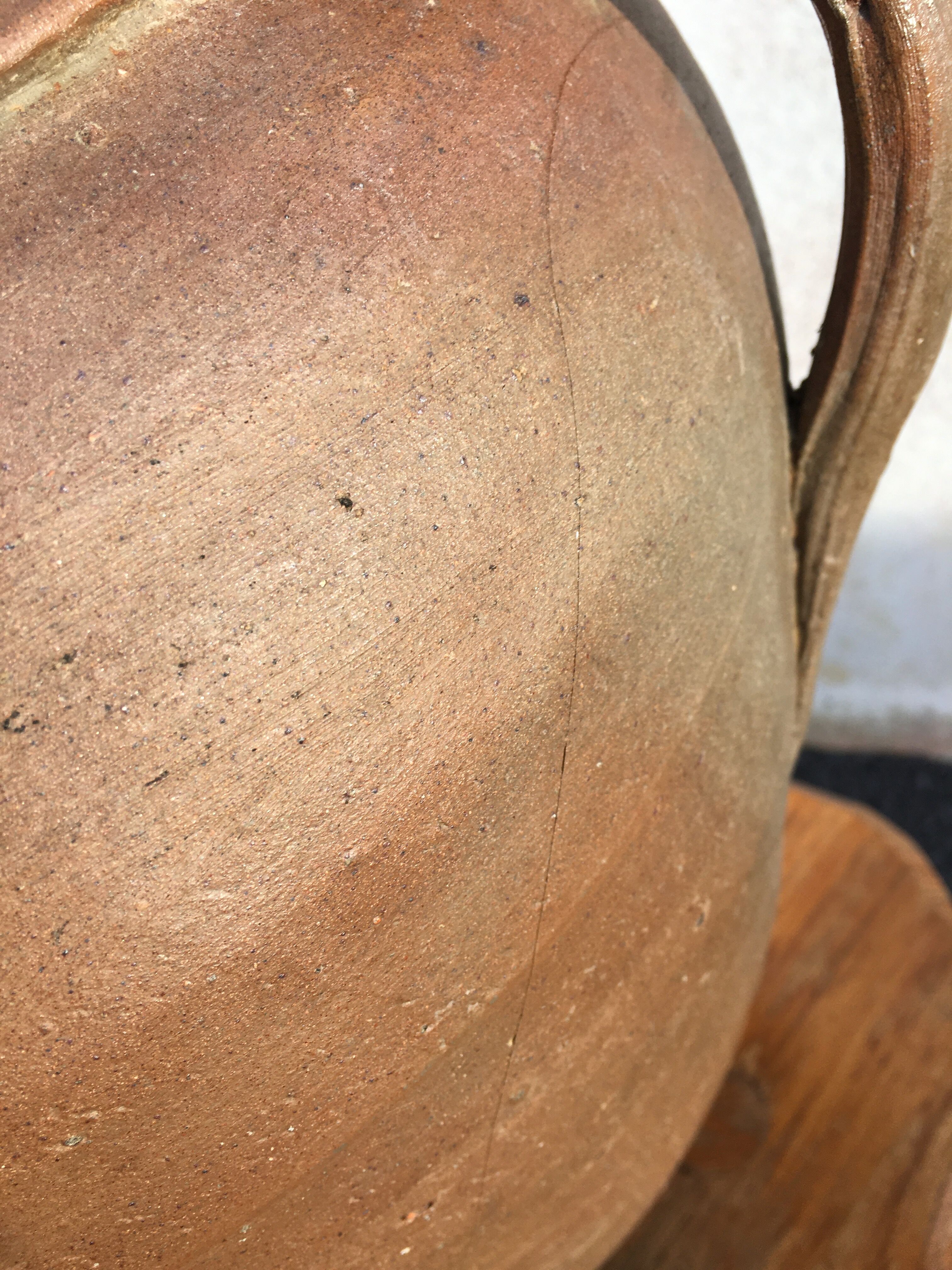 Old jug with two sandstone handles