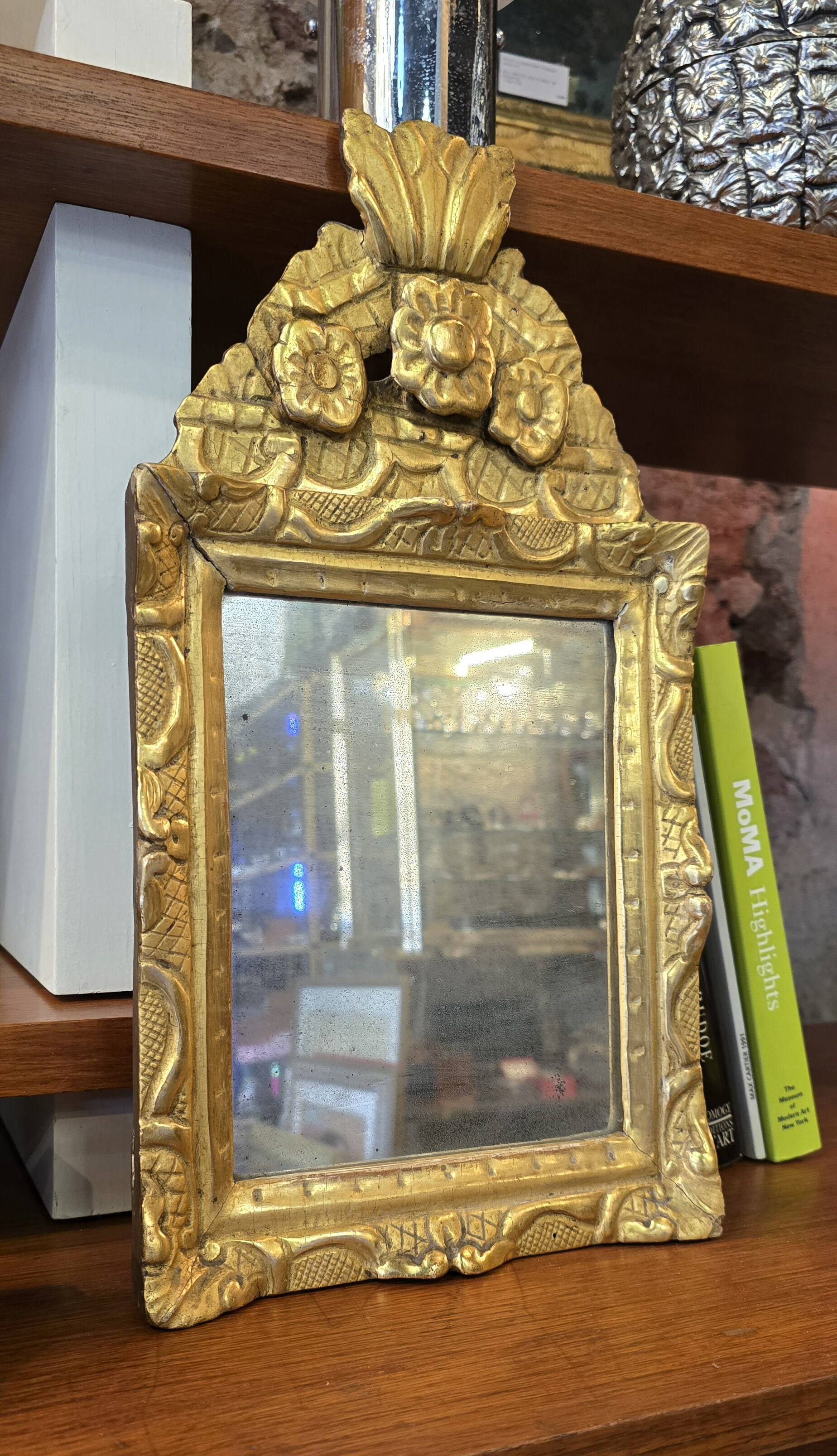 Small Louis XIV mirror in gilded carved wood from the early 18th century.
