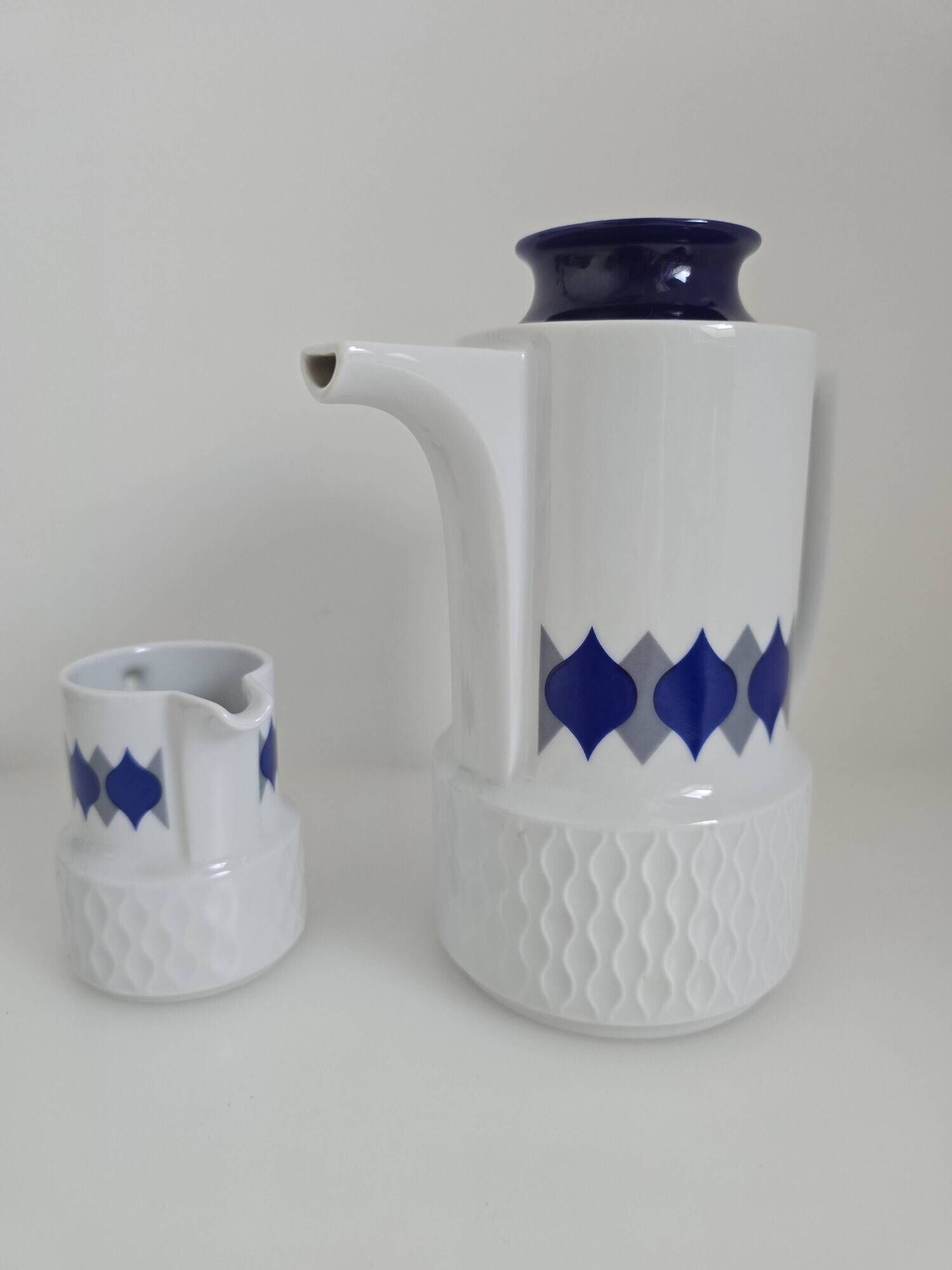Vintage Schirnding Bavaria coffee pot and milk jug, blue geometric pattern.