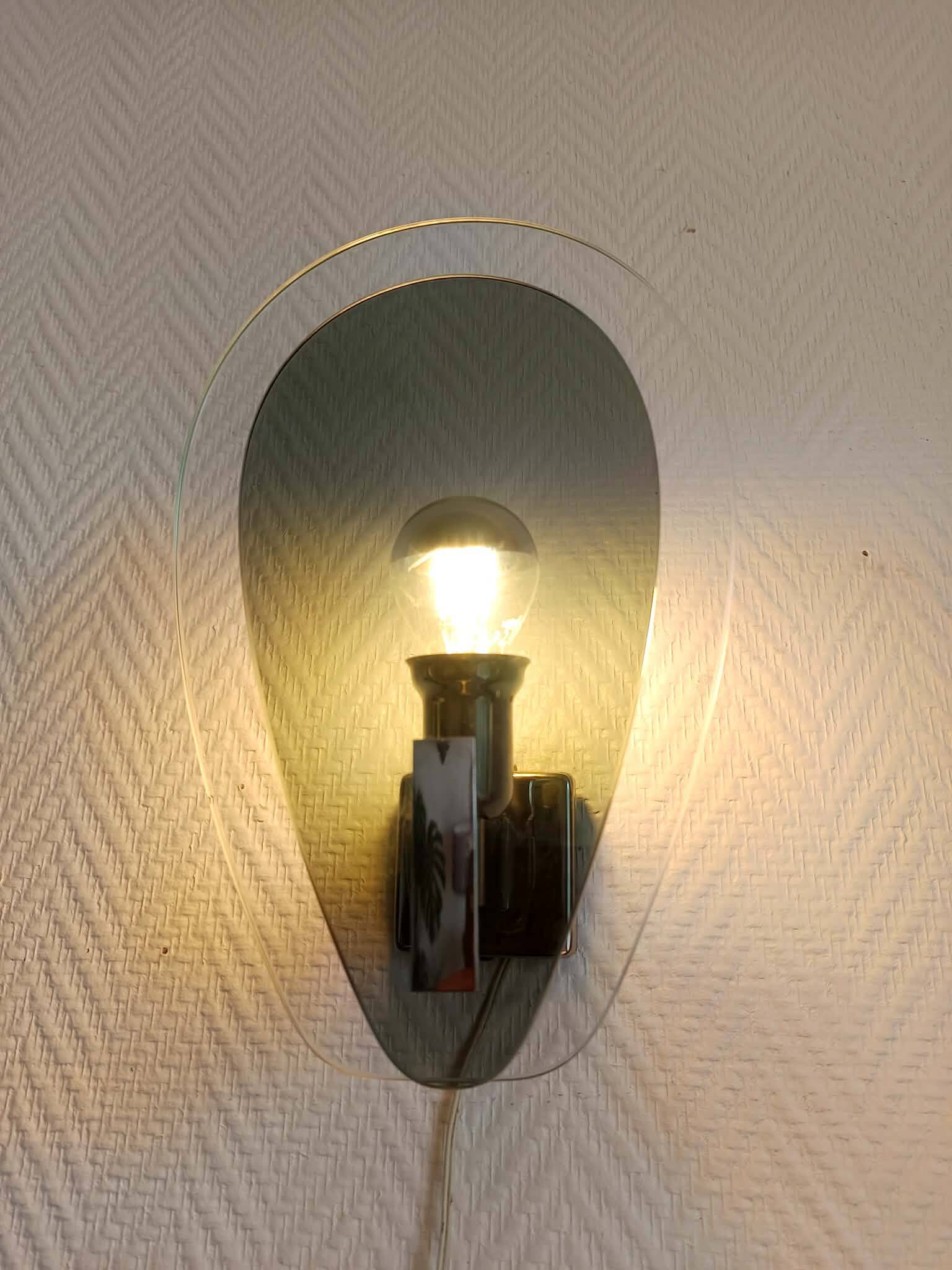 Pair of space age wall lights with smoked glass from the 1970s.
