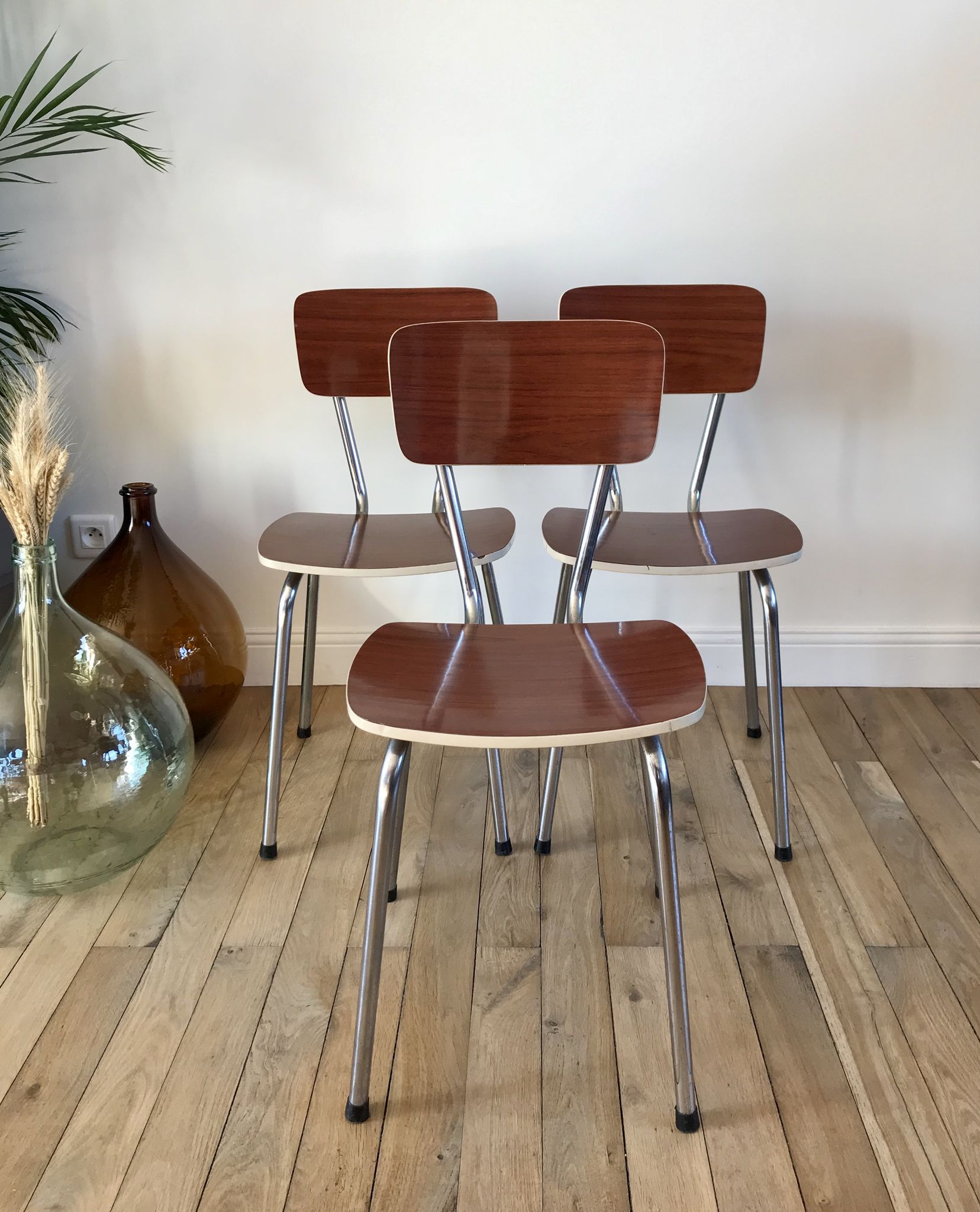 Trio of chairs in light brown formica and cream contour 70s