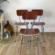 Trio of chairs in light brown formica and cream contour 70s