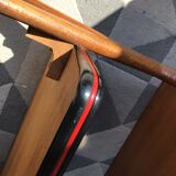 Double-footed red Formica wood spindles console