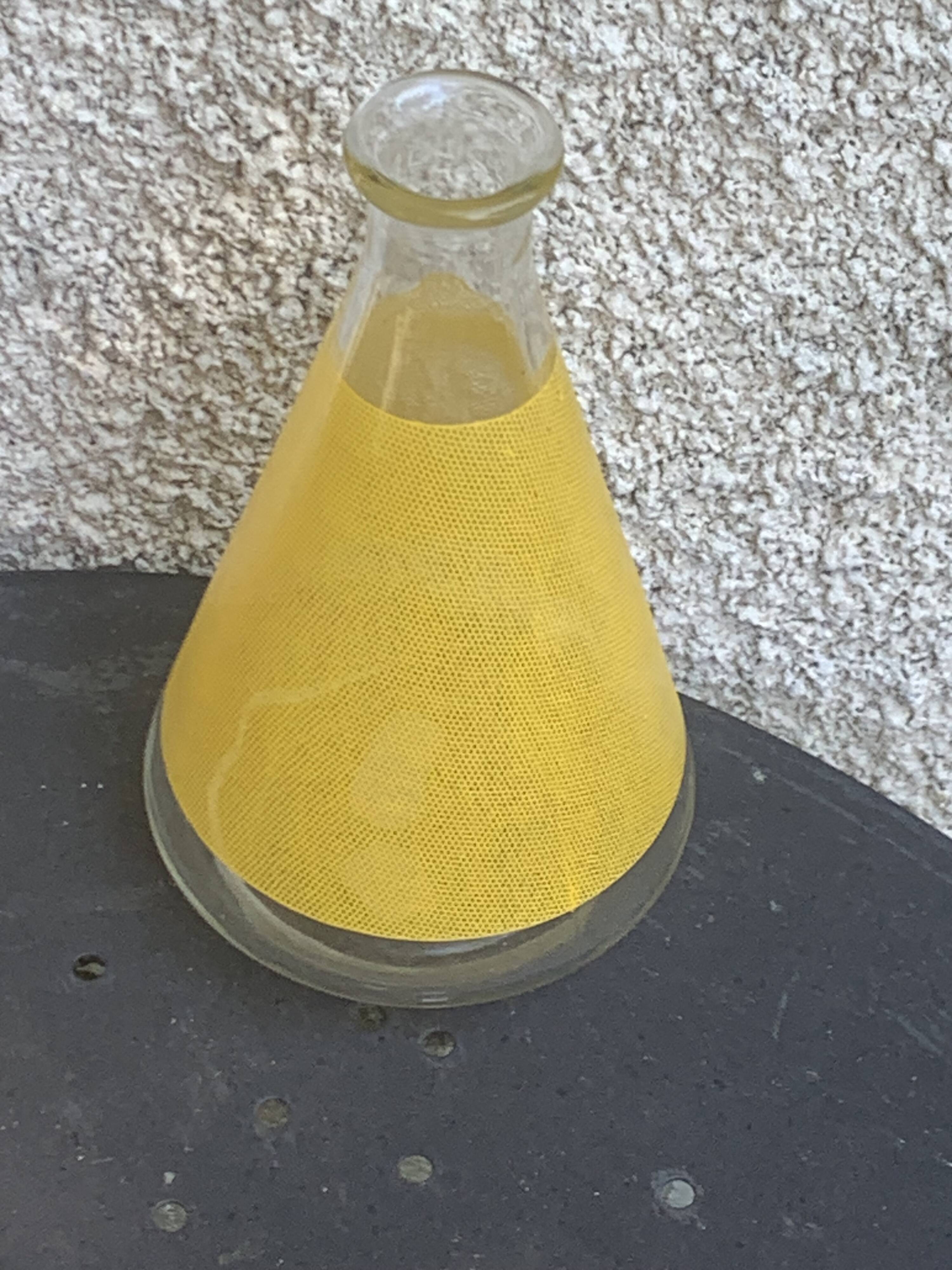 Liqueur set consisting of a glass carafe and 8 small yellow glasses