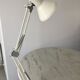 Off-white articulated architect lamp.