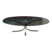 Oval smoked glass coffee table from the 1970s.