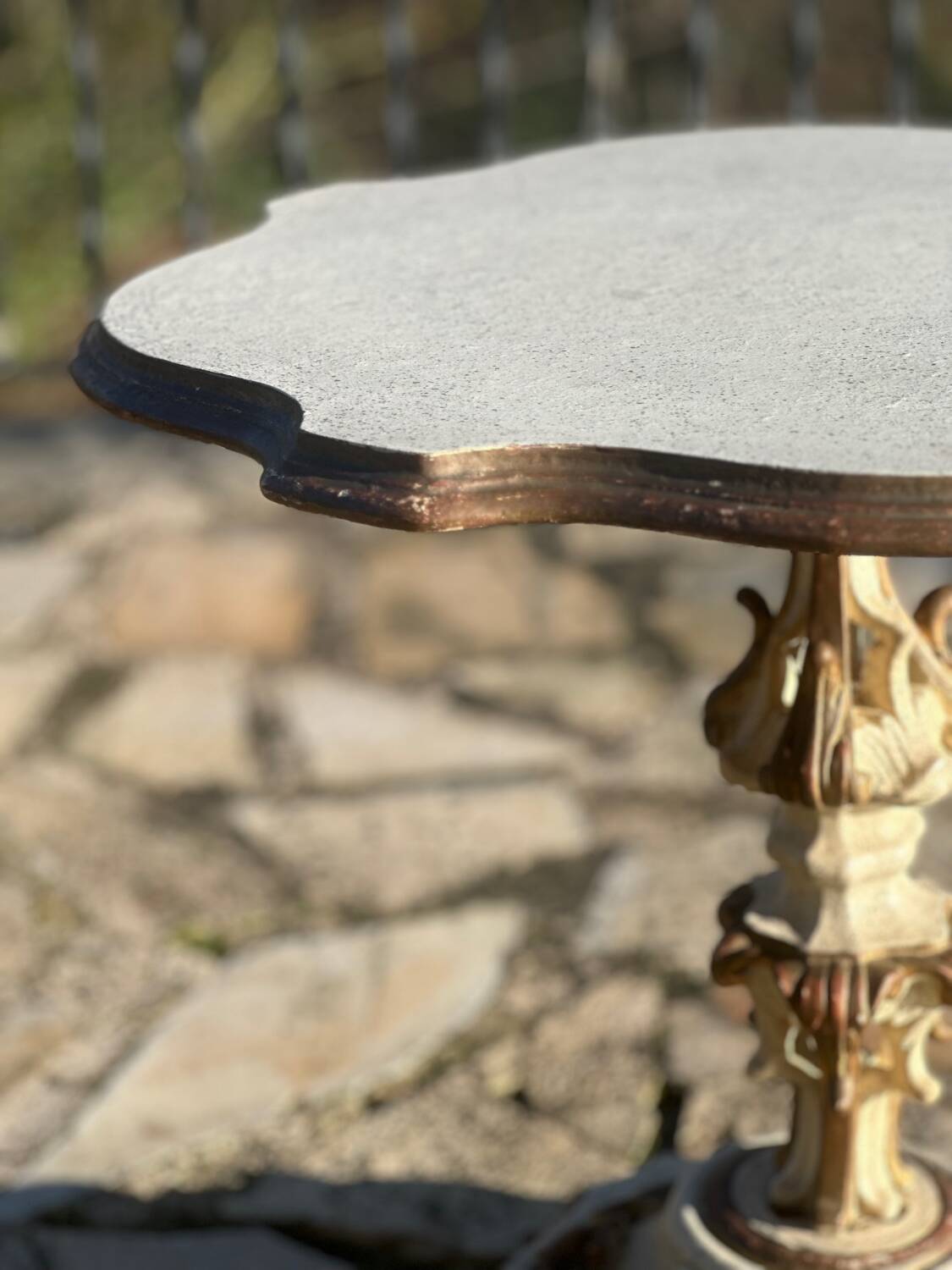 Carved and lacquered wooden side table.
