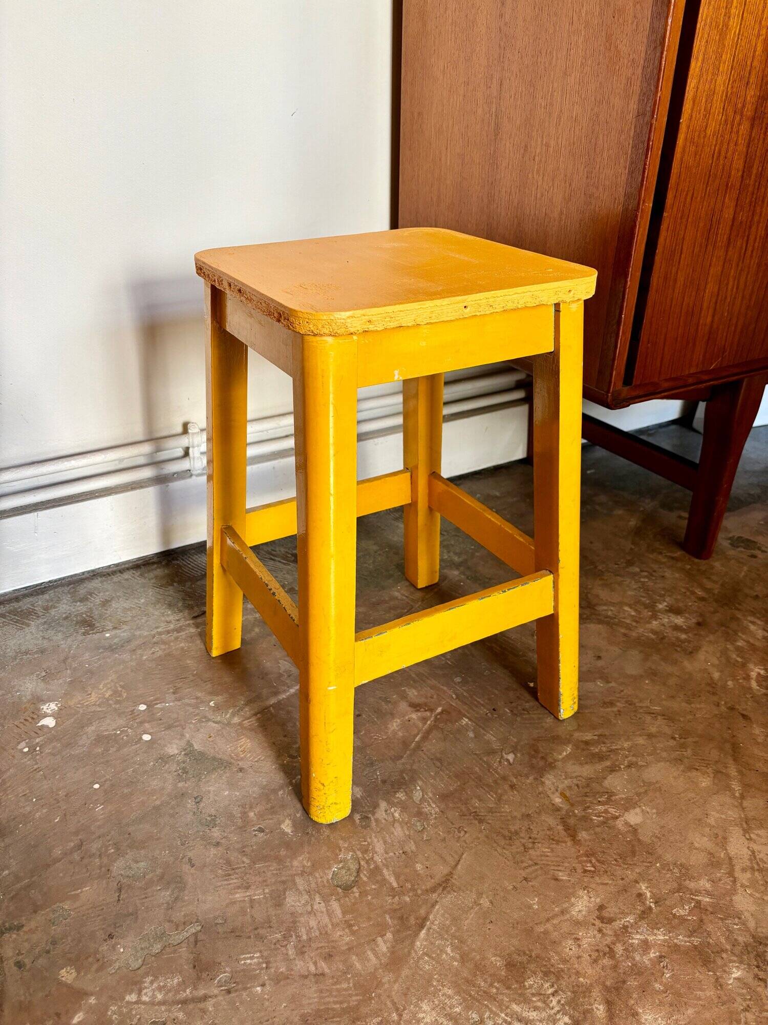 Yellow wooden stool