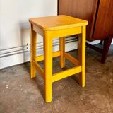 Yellow wooden stool