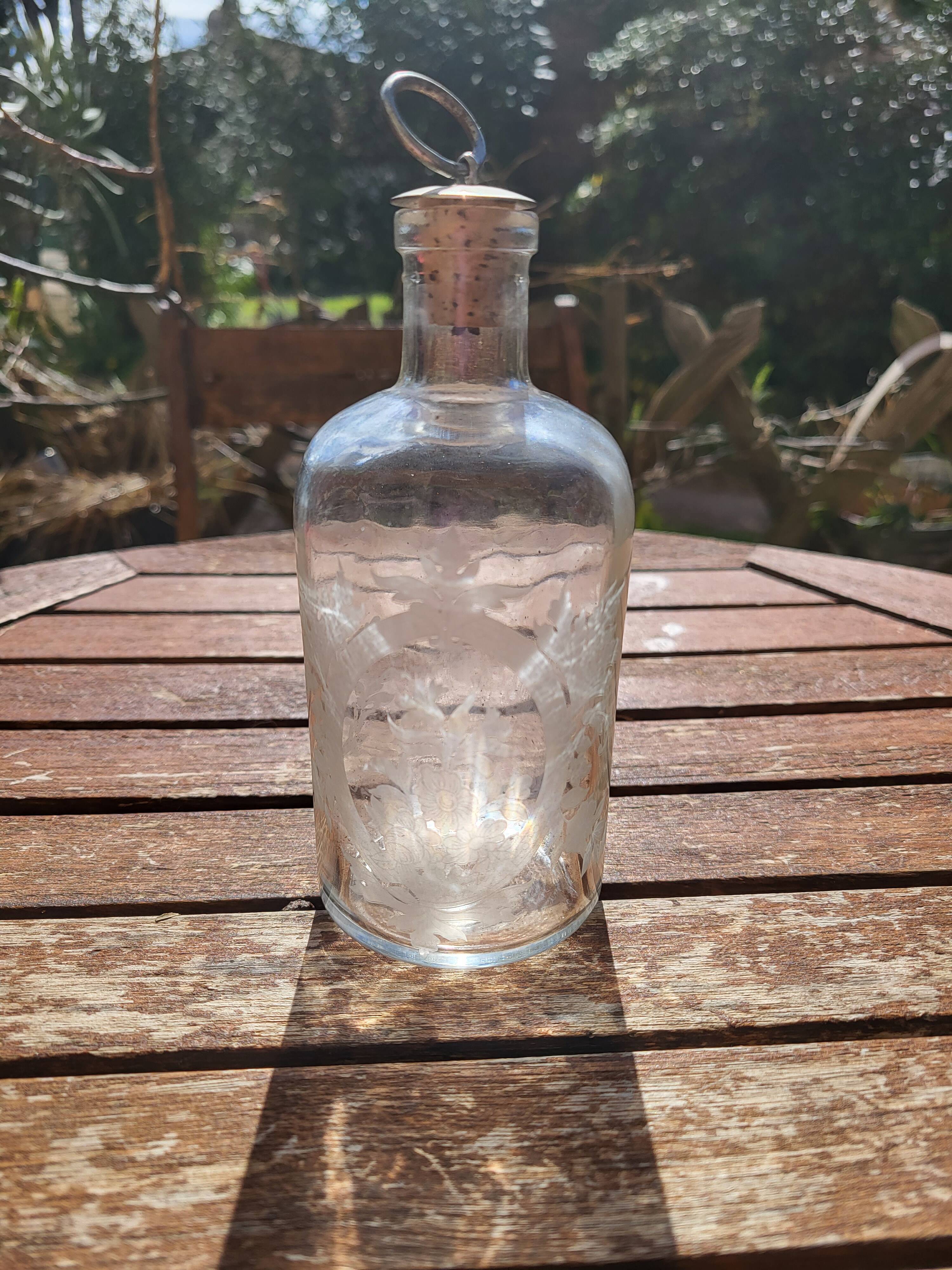 Engraved glass bottle