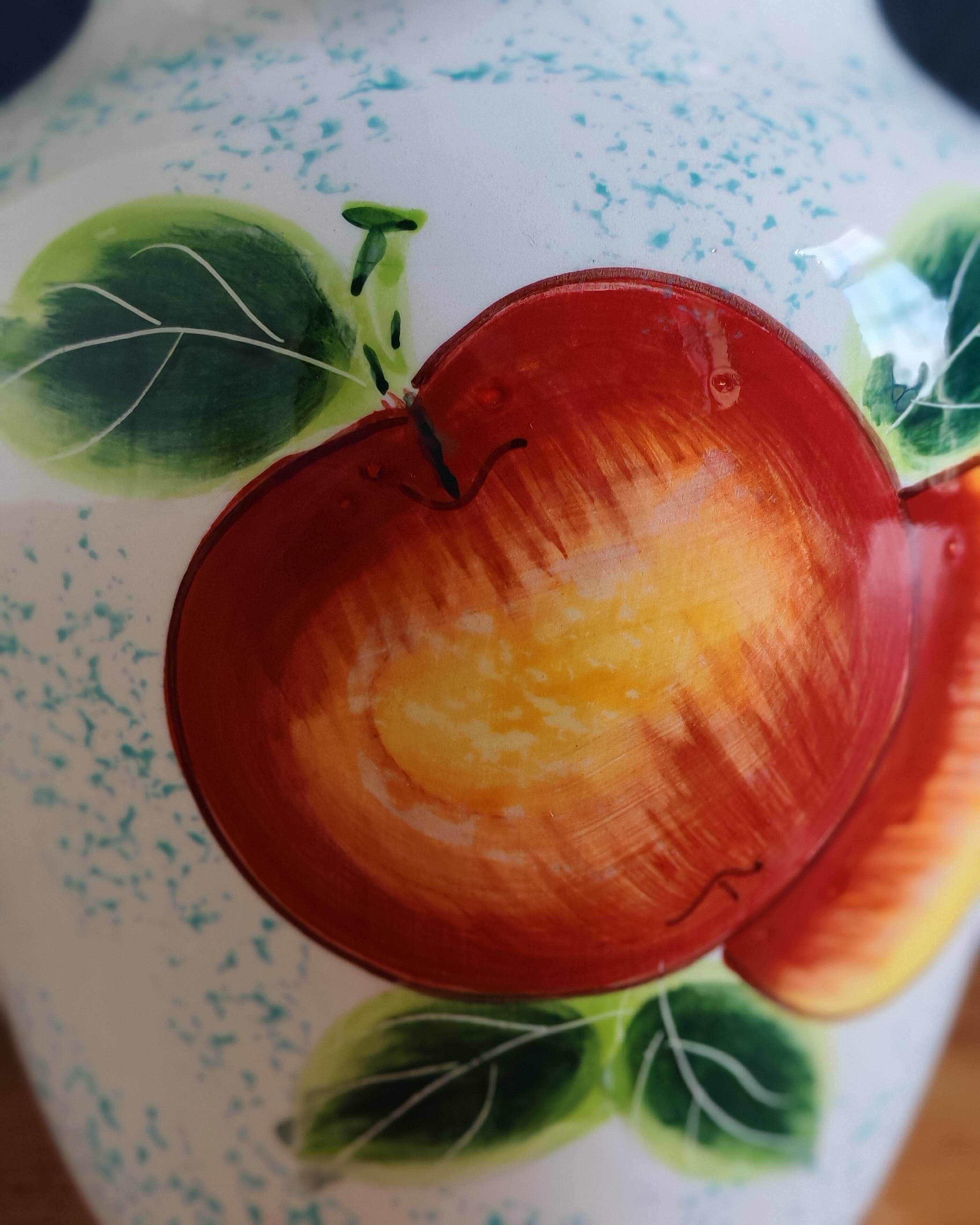 White Ceramic Vase with Peach and Leaf Motifs