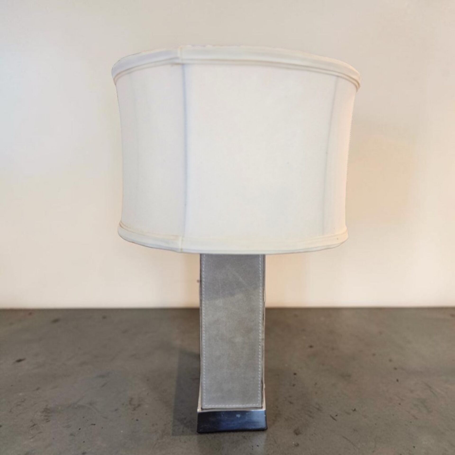 Stainless steel and suede lamp