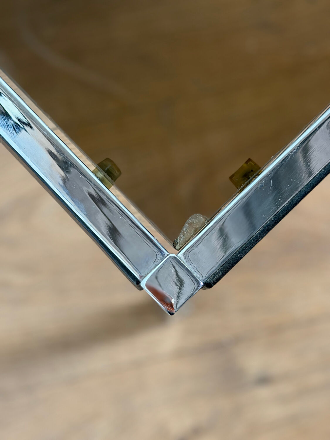 Large designer coffee table from the 70s in chrome, smoked glass, and faux leather.