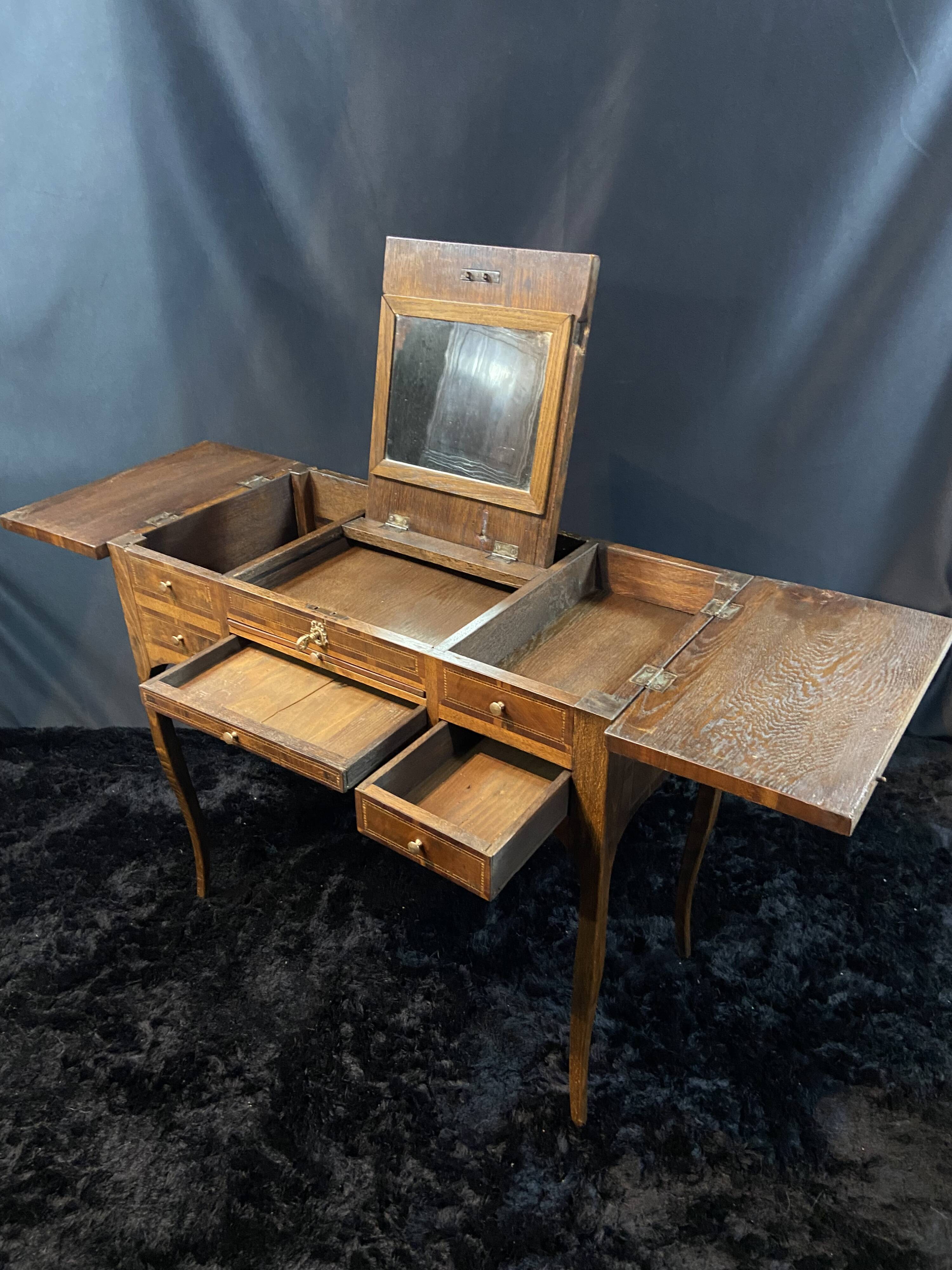 19th-century hairdresser with marquetry decoration on oak in the Louis XV Transition style.