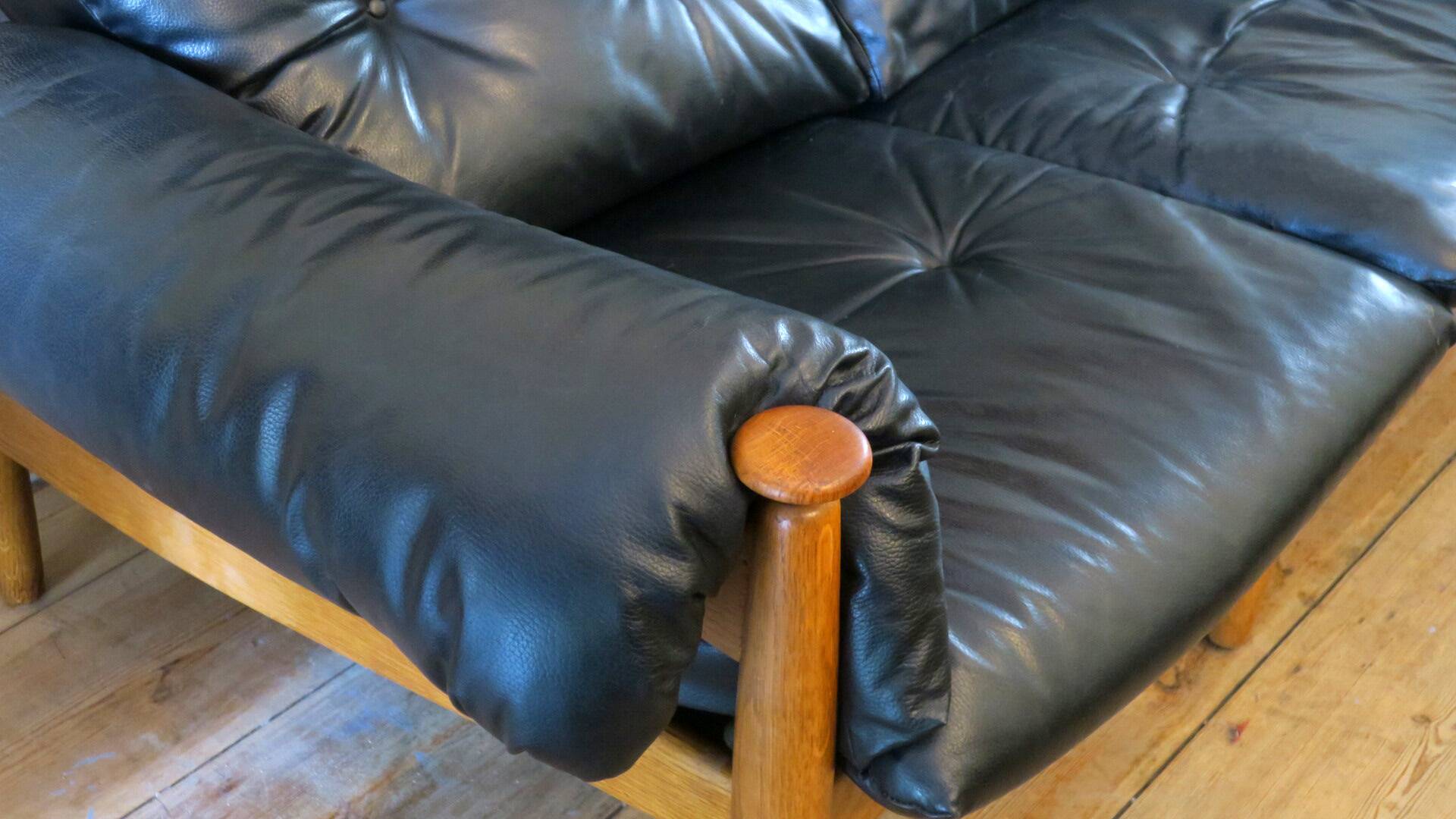 Eric Merthen leather sofa with matching ottoman, Sweden 1960s
